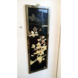 An oriental lacquered wall hanging