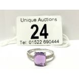 An 18ct white gold amethyst and diamond ring,