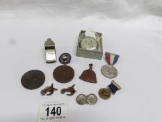 A mixed lot of commemorative medals and badges, vintage pedometer,