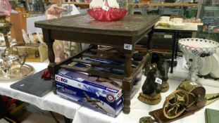 An ornate chess top coffee table