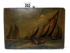 An early 19th century oil on board of fishing boats laying nets under sail