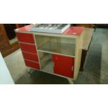 A 1950's red and white kitchen unit with melamine top