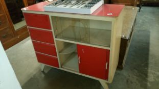A 1950's red and white kitchen unit with melamine top