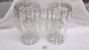 A pair of heavy cut glass lustre candlesticks