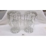 A pair of heavy cut glass lustre candlesticks