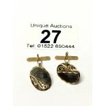 A pair of 9ct gold cuff links