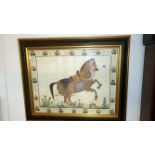 A framed and glazed fabric picture of a horse