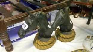 2 iron horse head door stops