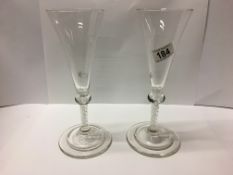 A pair of champagne flutes with internal twist stem