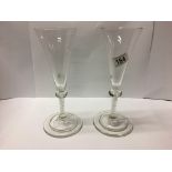 A pair of champagne flutes with internal twist stem