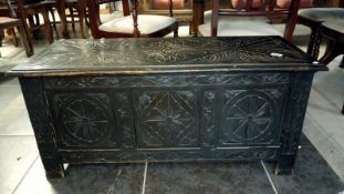 A late 19th century carved oak coffer