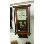 A Victorian inlaid wall clock