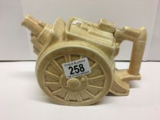 An early 20th century teapot in the shape of a artillery gun