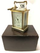 A brass carriage clock in original box marked Morrell & Hilton, Huntingdon,