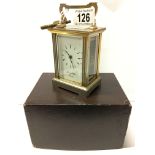 A brass carriage clock in original box marked Morrell & Hilton, Huntingdon,