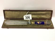 A cased silver and enamel paper knife