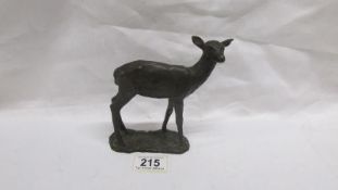 A bronze hand worked deer,