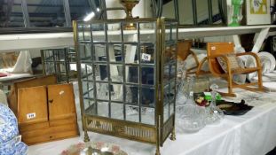 A Victorian brass and leaded glass fire screen