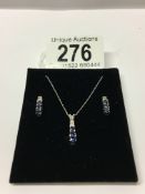 A 10k tanzanite and diamond necklace and earring set