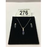 A 10k tanzanite and diamond necklace and earring set