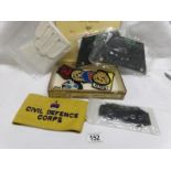 A cigar box of cloth badges, gloves,