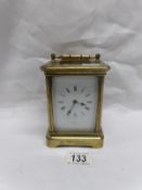 A brass carriage clock (rear glass a/f)