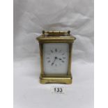 A brass carriage clock (rear glass a/f)