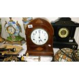 A mahogany inlaid mantel clock