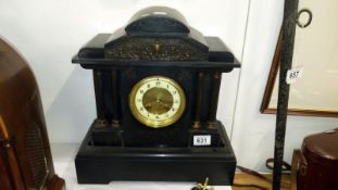 A black slate mantel clock