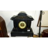 A black slate mantel clock