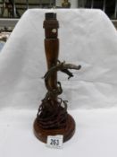 An oriental table lamp base with entwined dragon