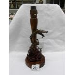 An oriental table lamp base with entwined dragon