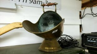 A brass coal scuttle