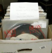 A box of in excess of 80 mixed LP records and 12" singles including heavy rock, prog rock,