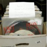 A box of in excess of 80 mixed LP records and 12" singles including heavy rock, prog rock,