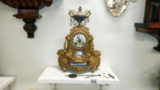 A French gilt mantel clock with enamel dial