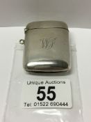 A silver vesta case