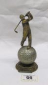 An art deco spelter Lorenzl style striker lighter in the form of a golfer (missing wand)