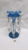 A blue glass lustre vase with crystal droppers