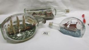 3 model ships in bottles