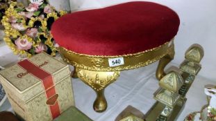 A gilded kidney shaped footstool