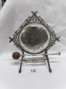 An ornate silver plated table gong