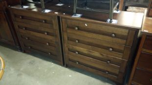 A pair of dark oak 4 drawer chests