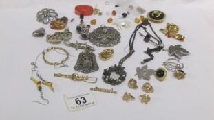 A mixed lot of brooches and earrings