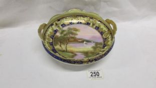 A Noritake hand decorated and gilded bowl