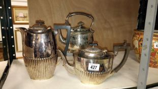 A silver plated spirit kettle on stand and 2 tea pots