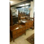 A 1930's oak dressing table and 2 drawer chest