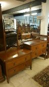 A 1930's oak dressing table and 2 drawer chest