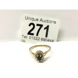 A 9ct yellow gold sapphire and diamond ring