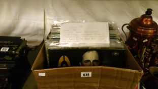 A box of in excess of 70 LP records including Saxon, Peter Townsend, Sisters of Mercy, Poison,